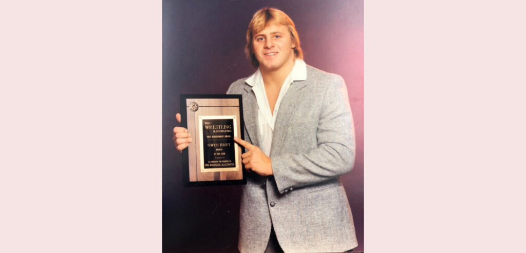 Owen Hart with a award